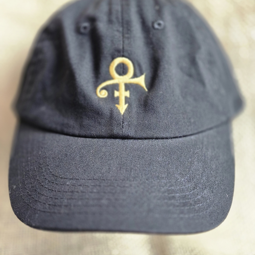 Prince Black Hat with Gold Logo